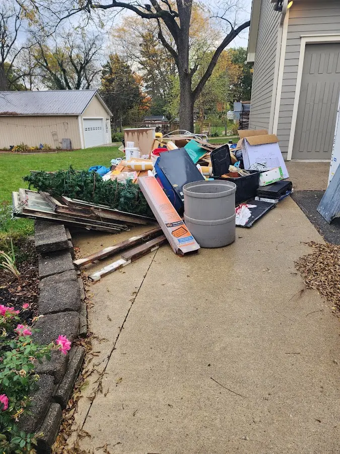 Dumpster being loaded with debris for Commercial Dumpster Rental in Roanoke